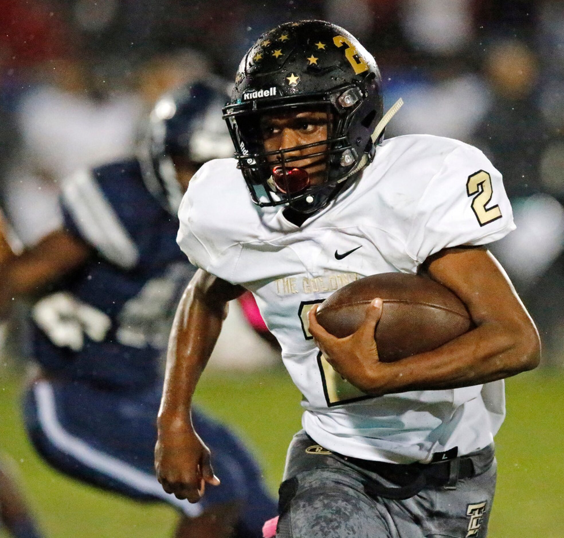 The Colony High School running back Myles Price (2) carries the football close to the goal...