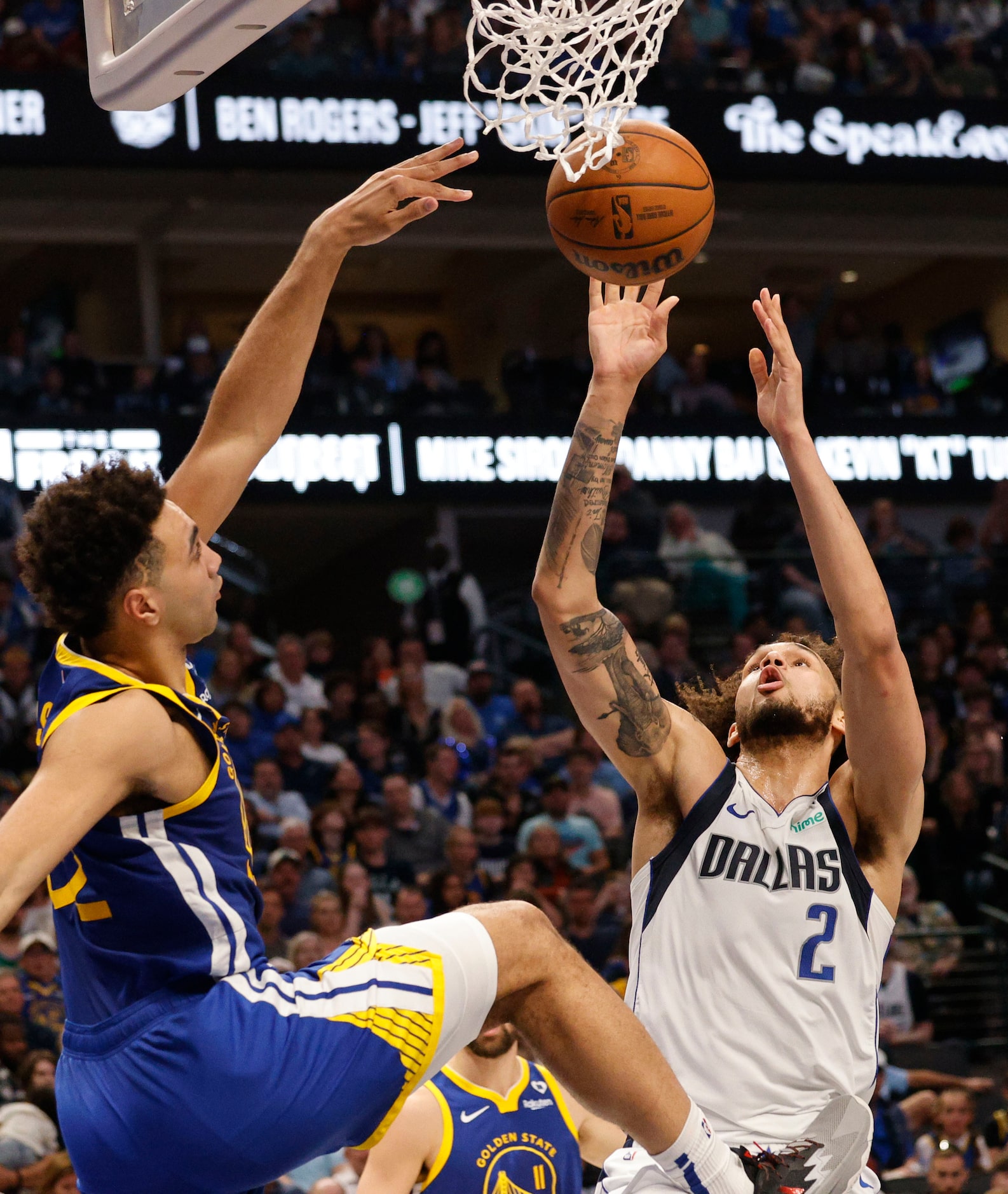 Dallas Mavericks center Dereck Lively II (2) and Golden State Warriors forward Trayce...