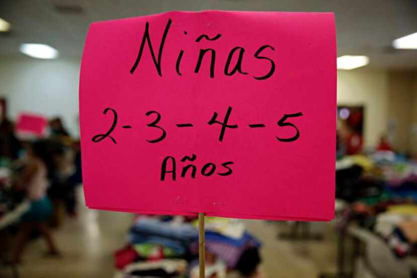 
A sign tells of girls clothing for ages two through five at Sacred Heart Catholic Church...