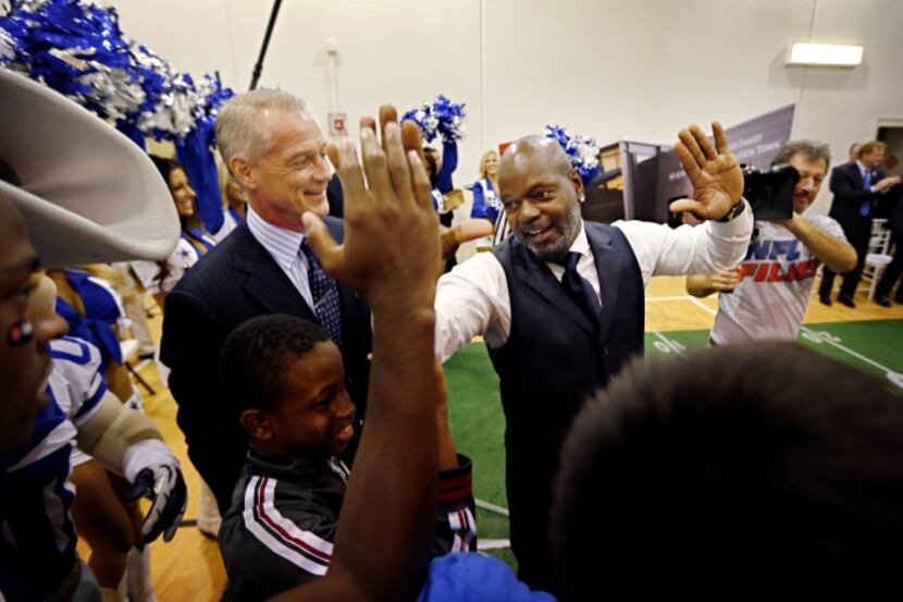 Former Dallas Cowboys player Daryl Johnston (second from left) looked on as Emmitt Smith...