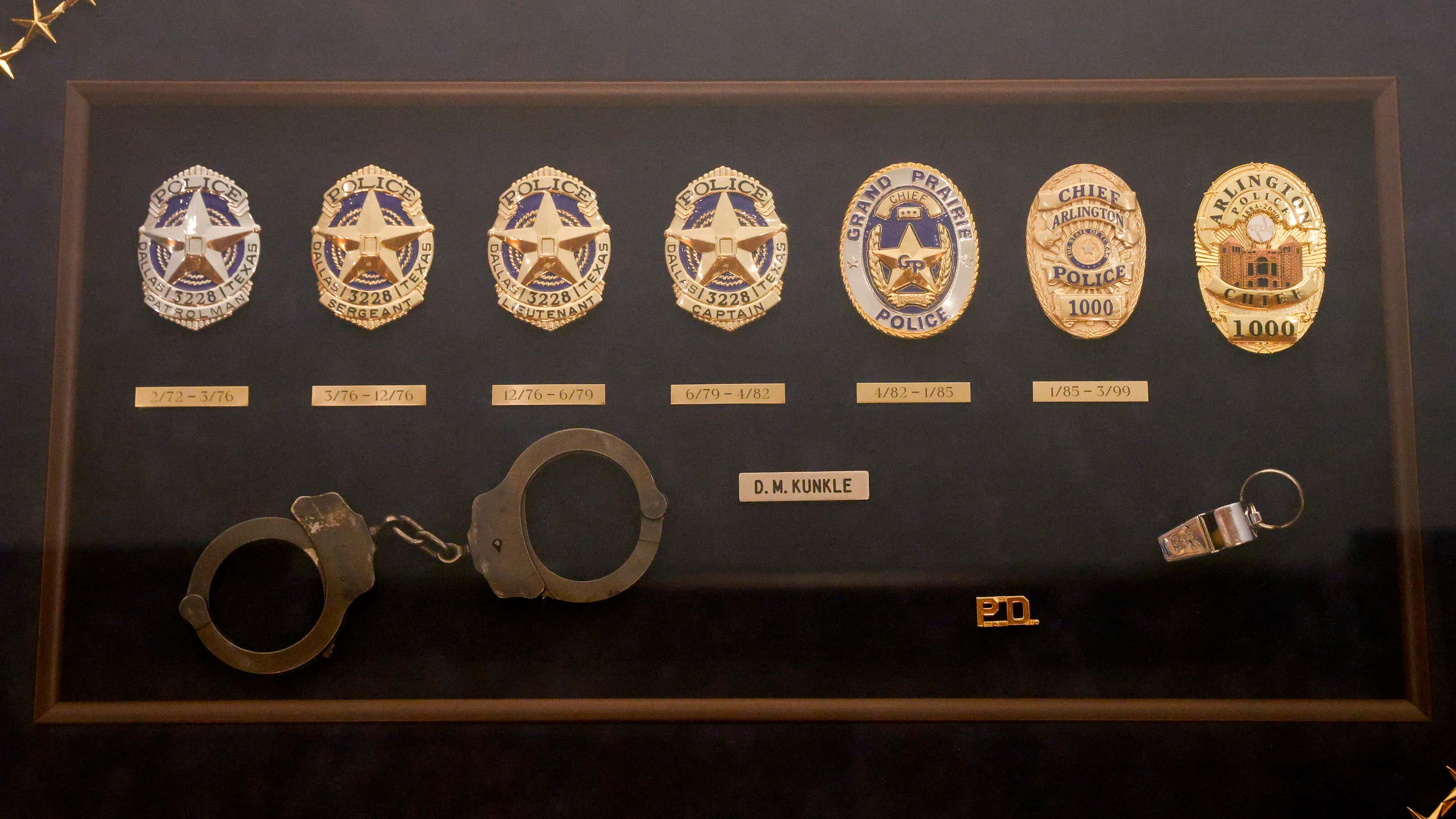 Several badges from David Kunkle’s career as a police officer at Arlington, Grand Prairie...