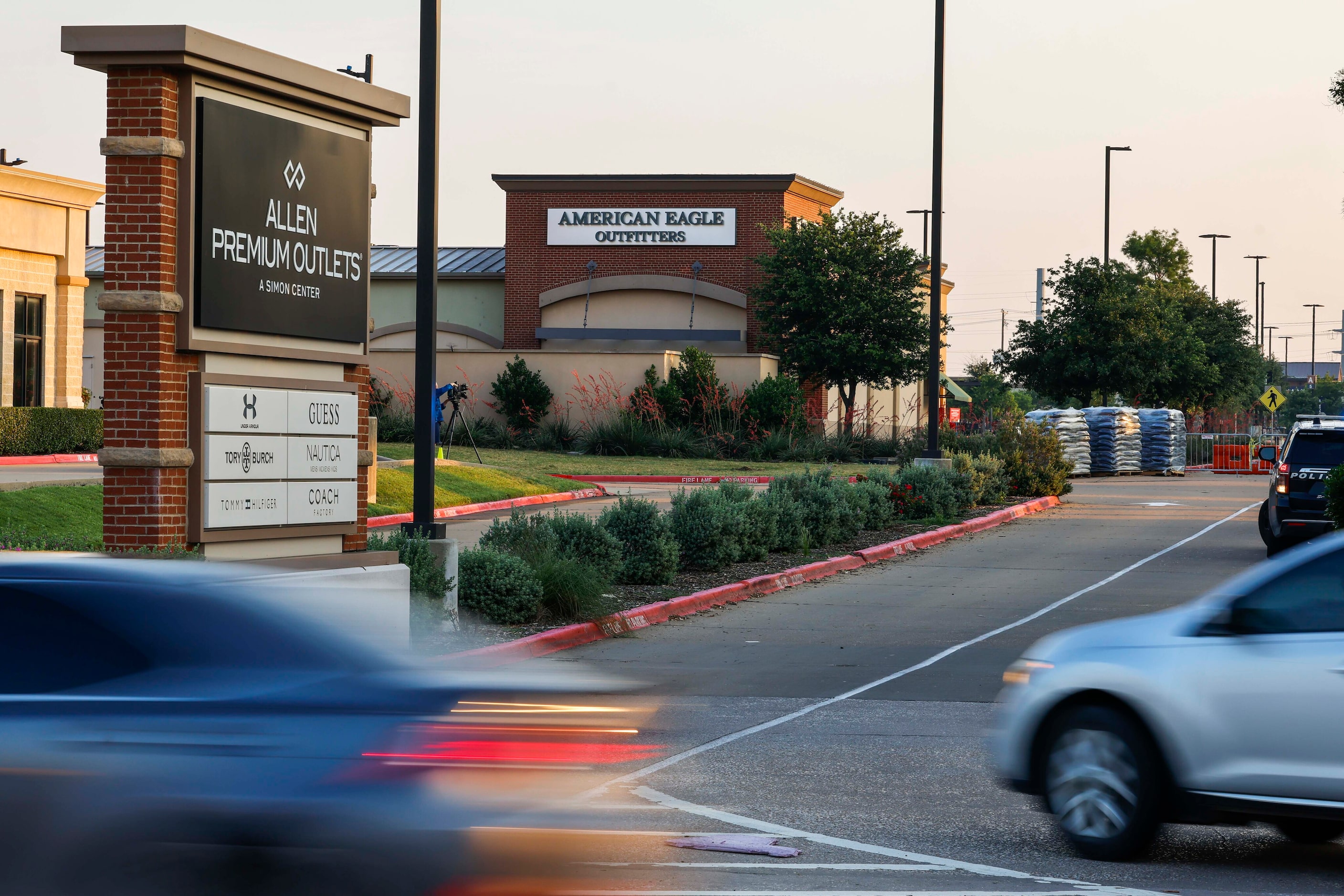 Traffic passes along Stacy Road on the day of the reopening of the Allen Premium Outlets...