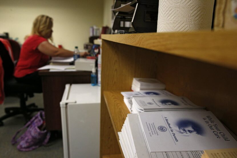 A Tarrant County child-abuse investigator caught up on paperwork last summer. (Nathan...