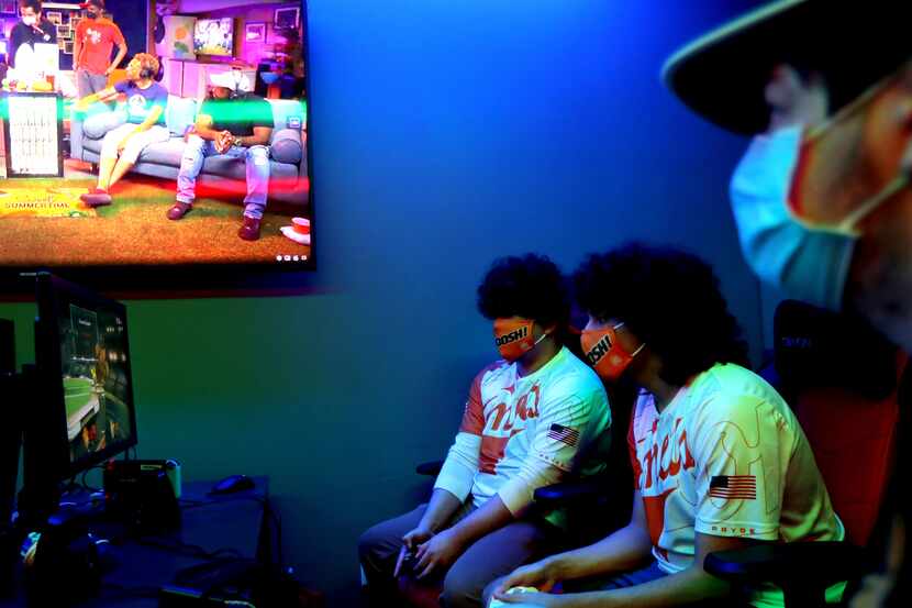 From left, Chaynen Casas, Marcel Hayek and Sean Fox of the Super Smash Bros team play at the...