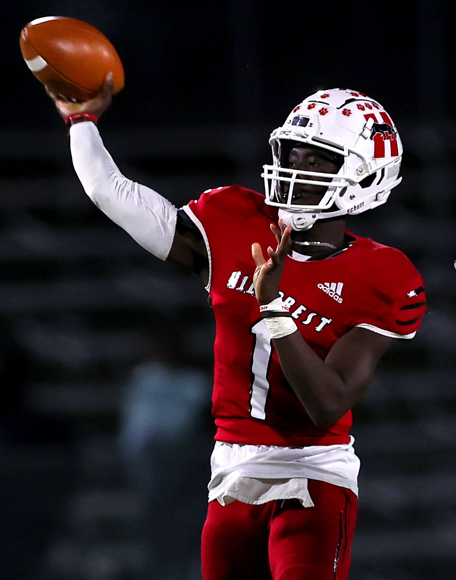 Hillcrest quarterbak Carter Sido attempts a pass against Spruce during the first half of a...