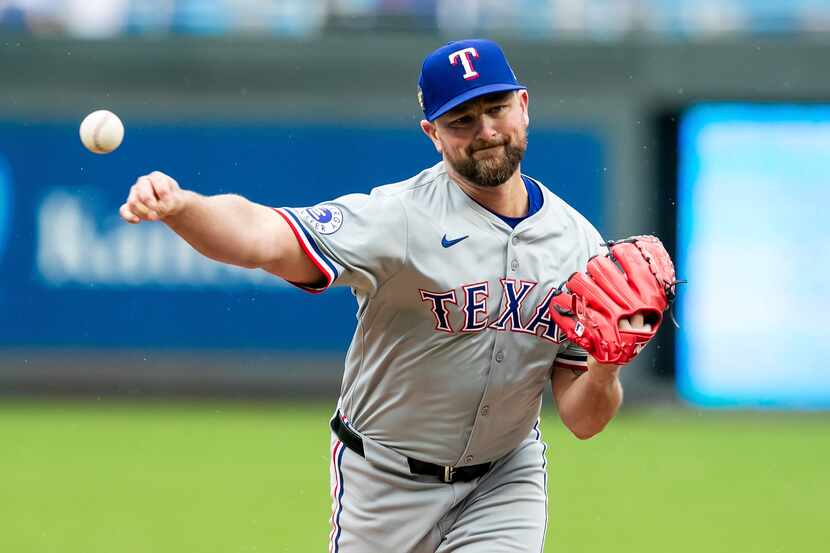 Texas Rangers pitcher Kirby Yates pitches the ball during a baseball game against the Kansas...