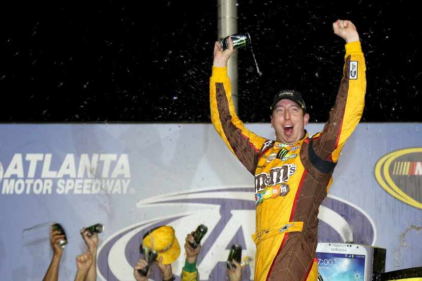 HAMPTON, GA - SEPTEMBER 01:  Kyle Busch, driver of the #18 M&M's Toyota, celebrates in...