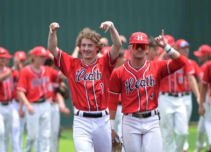 Rockwall Heath's Baylor Baumann (1) and Jett Williams (4) celebrate after their win of game...