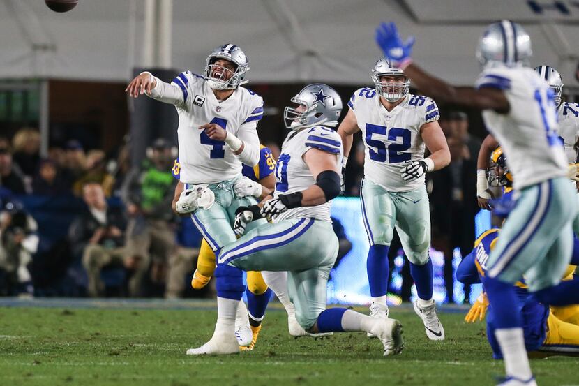 Dallas Cowboys quarterback Dak Prescott (4) fires off a pass during the first half of a NFC...
