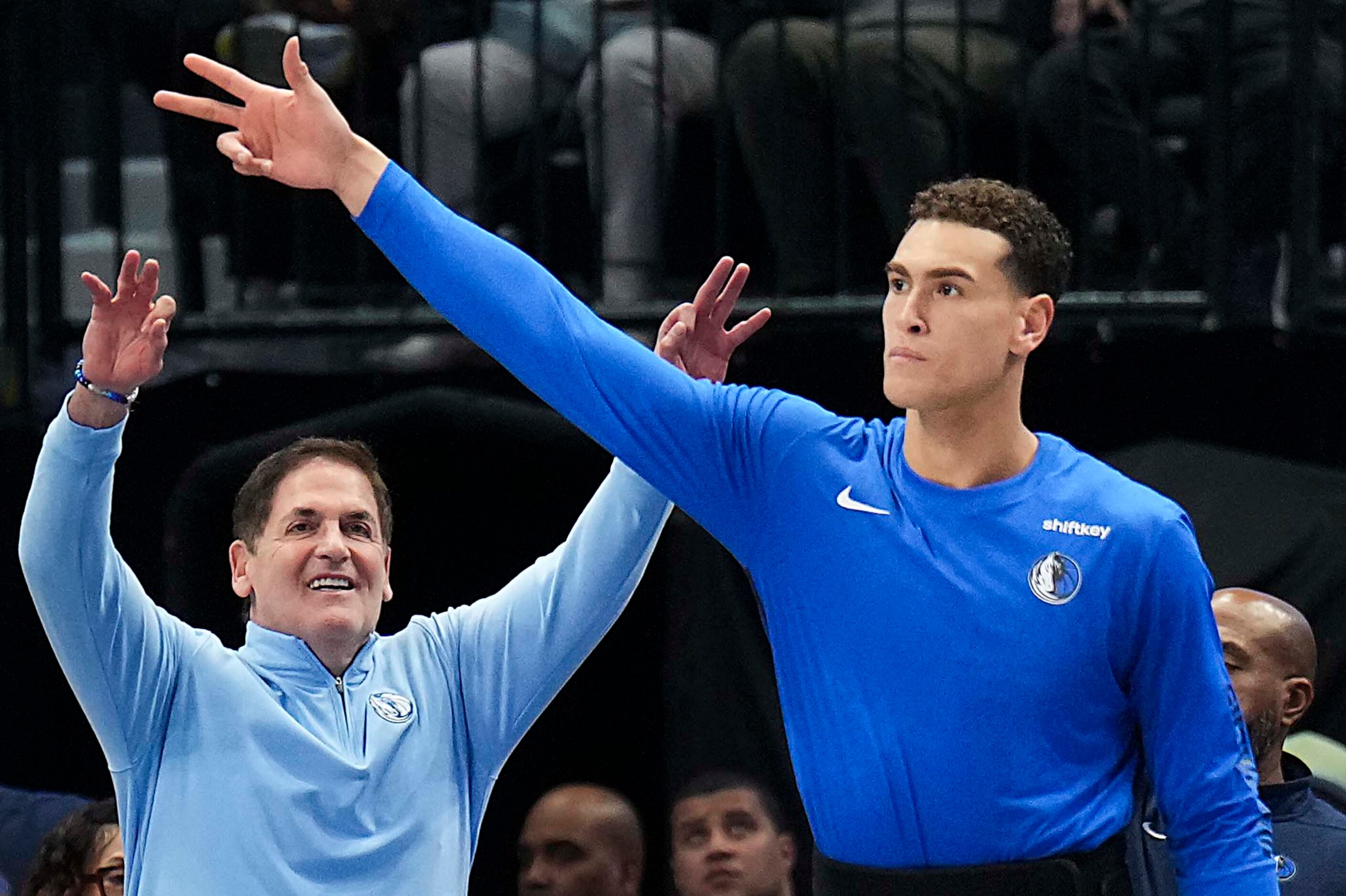 Dallas Mavericks governor Mark Cuban and center Dwight Powell celebrate a three-pointer...