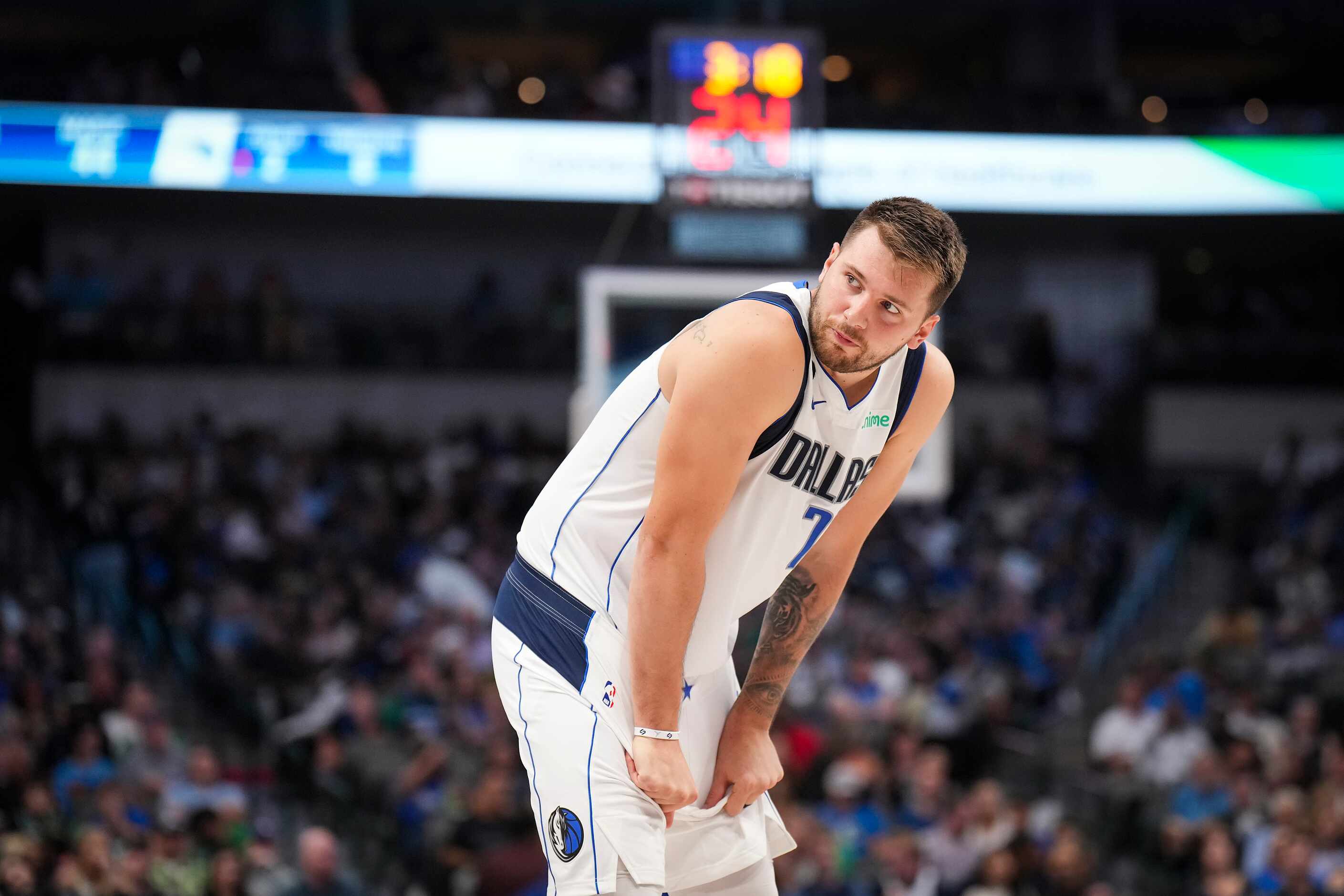 Dallas Mavericks guard Luka Doncic looks to a referee during the first half of an NBA...