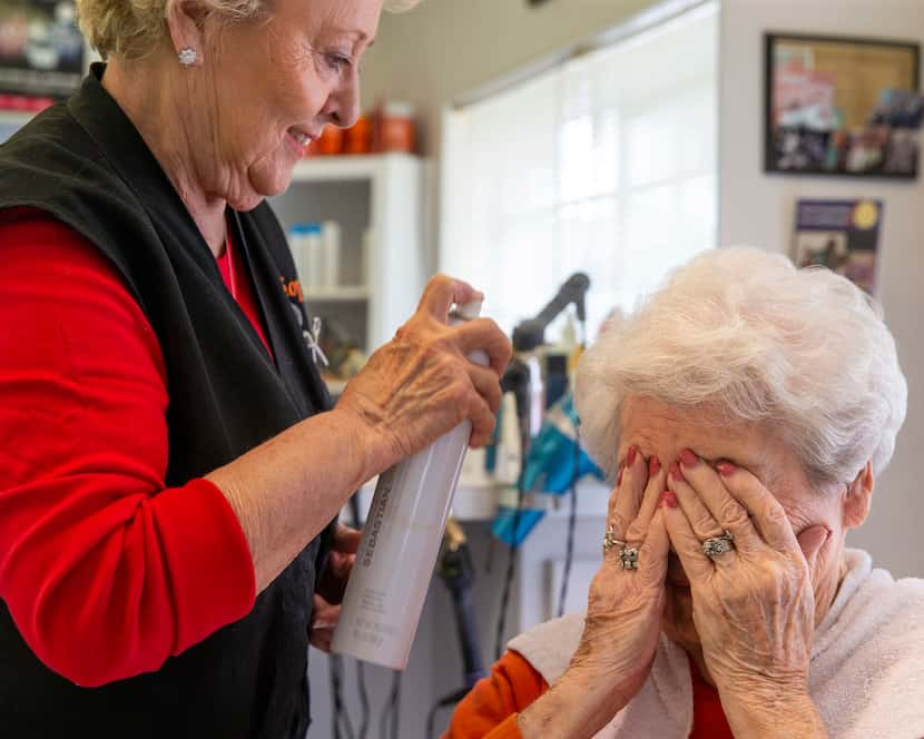 Shirley O'Neal (left) set Peralea Pell's hair with hair spray at Shirley's Hair Shop in...