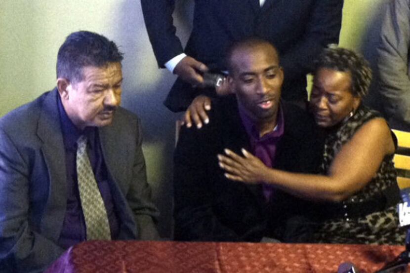 Jabin Akeem Bogan sat with his mother, Aletha Smith, at a news conference Friday with...