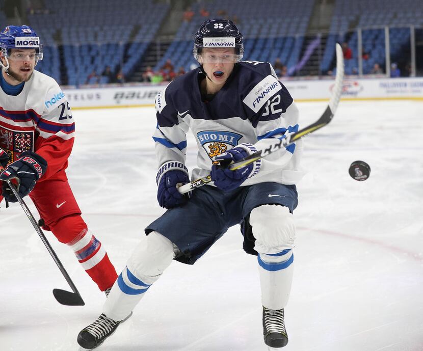 BUFFALO, NY - JANUARY 02: Aleksi Heponiemi #32 of Finland eyes a loose puck against the...