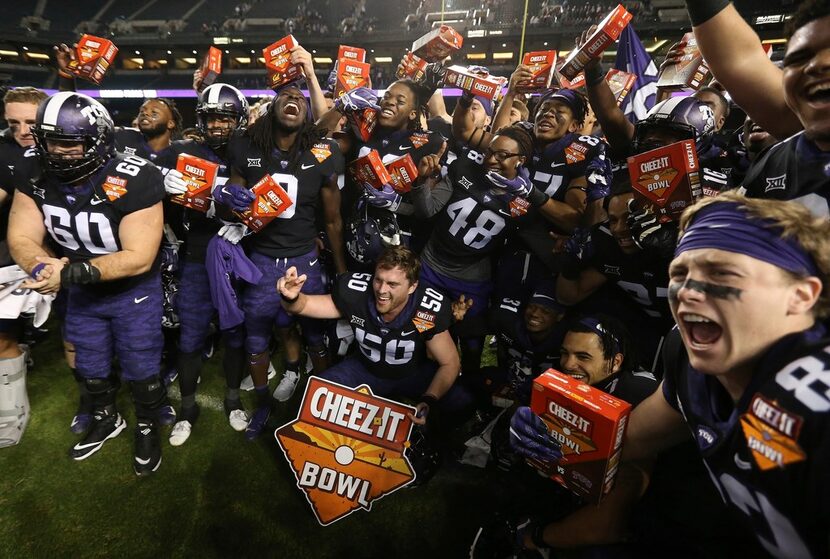 TCU players celebrate a 10-7 overtime win against California in the Cheez-It Bowl NCAA...