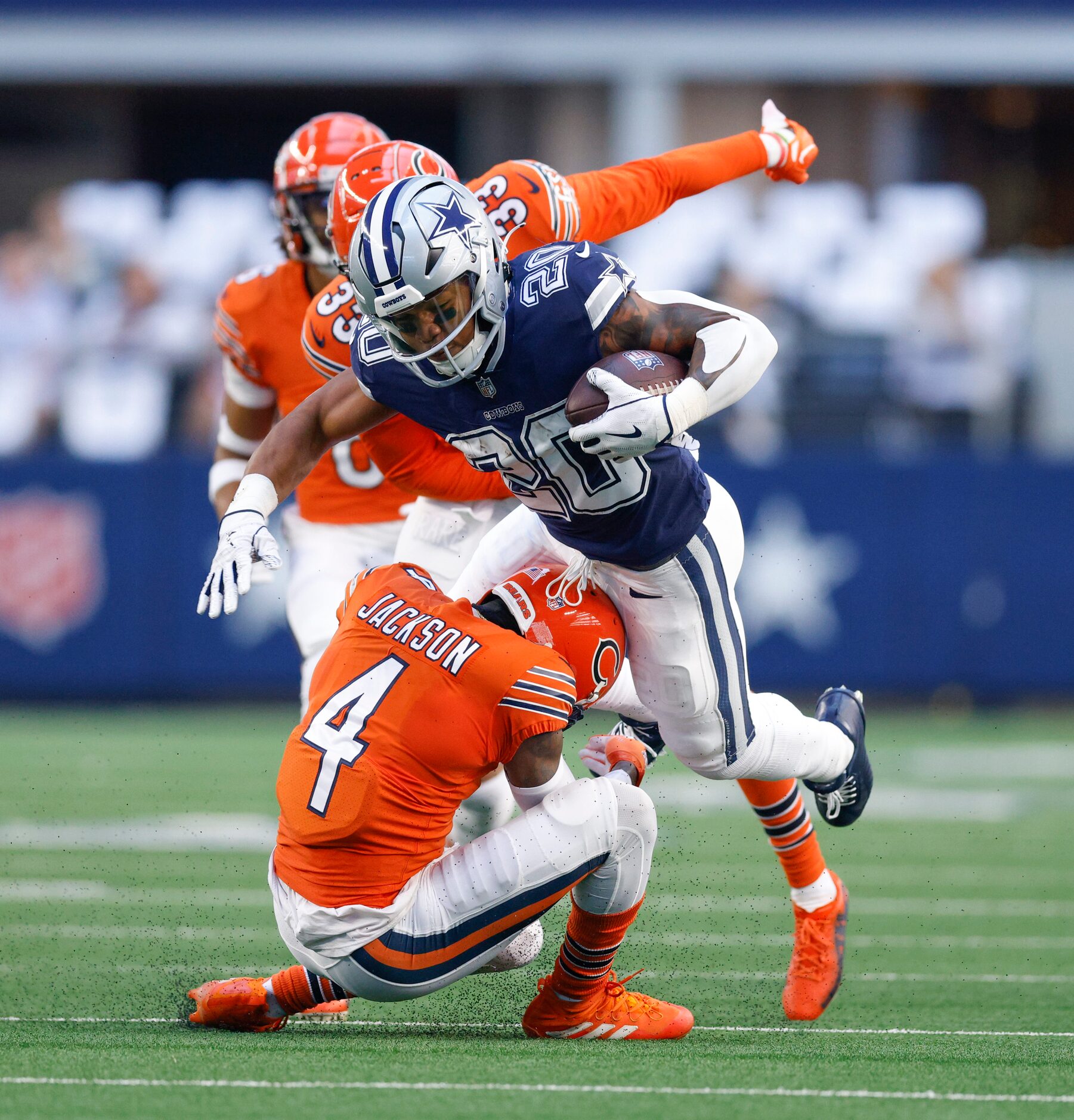 Chicago Bears safety Eddie Jackson (4) tackles Dallas Cowboys running back Tony Pollard (20)...