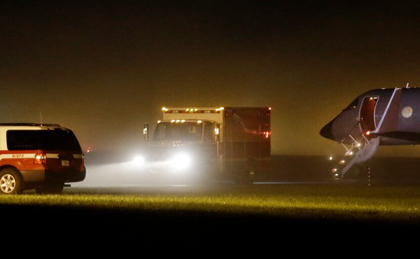 An ambulance with nurse Nina Pham aboard leaves Frederick Municipal Airport in Frederick,...