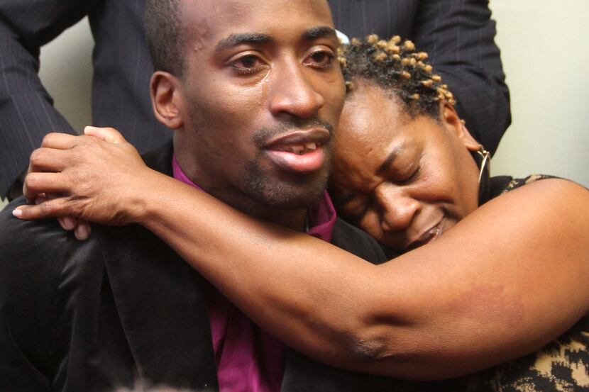 Aletha Smith embraces her son, truck driver Jabin Akeem Bogan, 27, during a press conference...