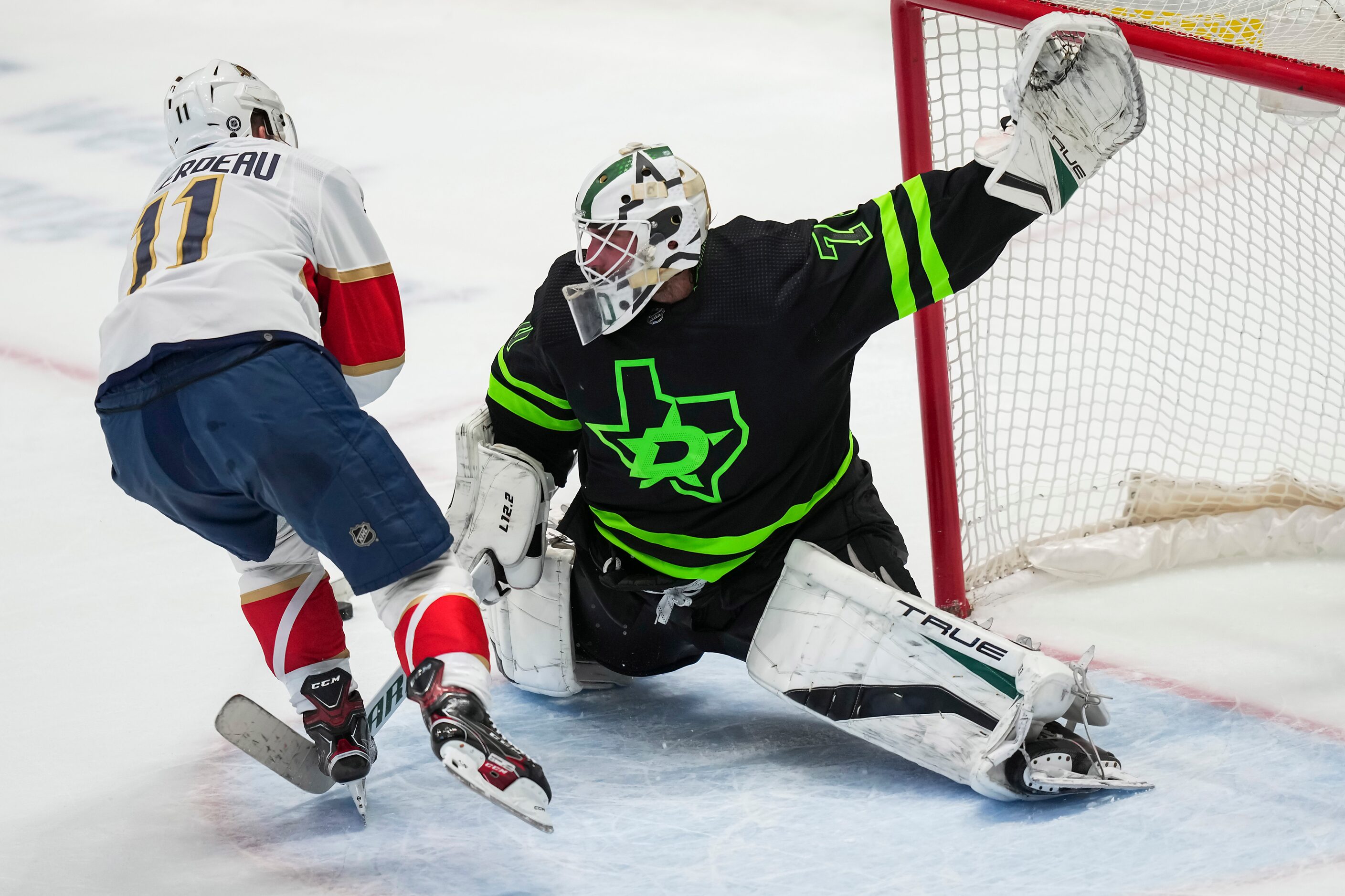 Dallas Stars goaltender Braden Holtby (70) turns away Florida Panthers left wing Jonathan...