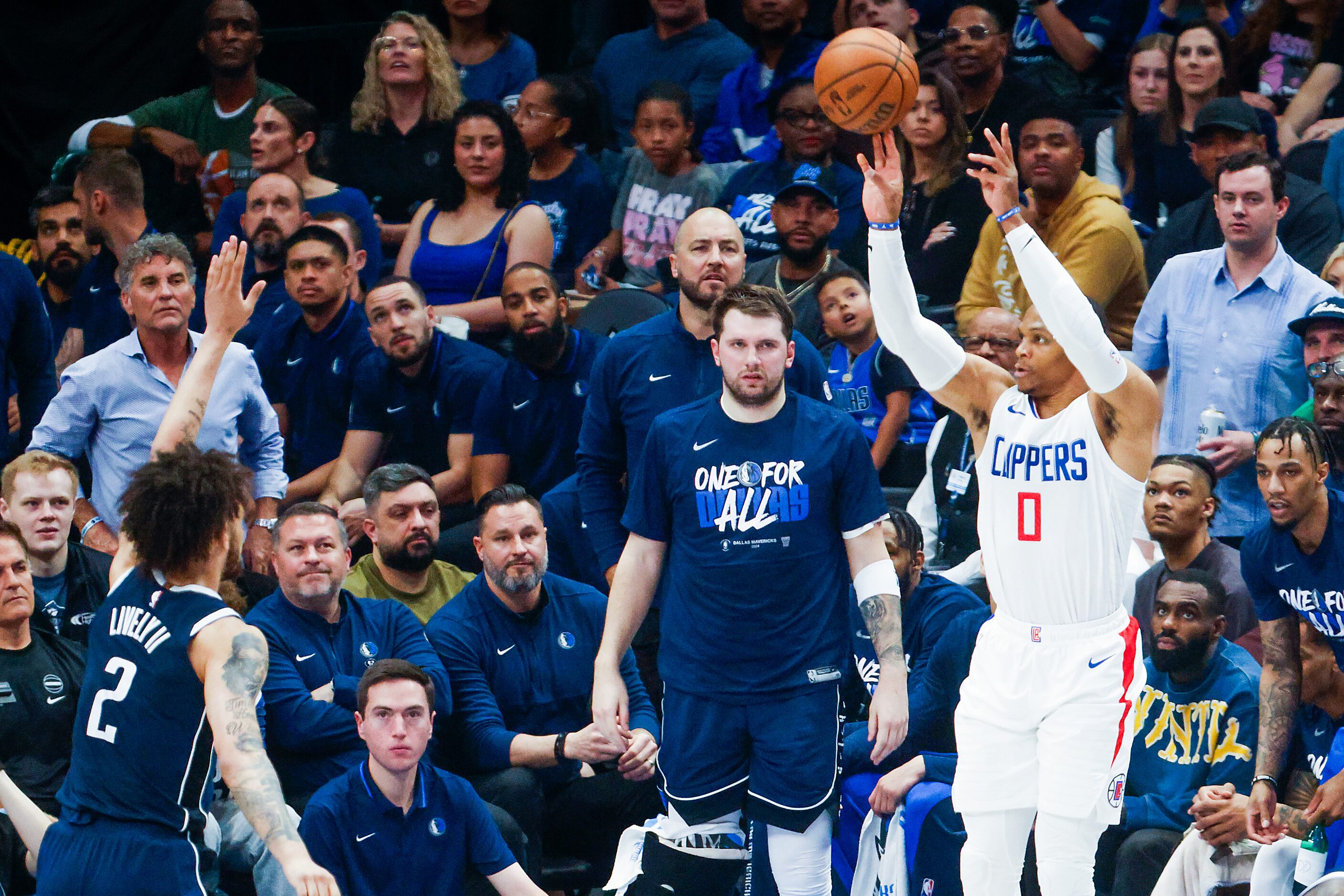 LA Clippers guard Russell Westbrook (0) shoots a three-pointer over Dallas Mavericks center...