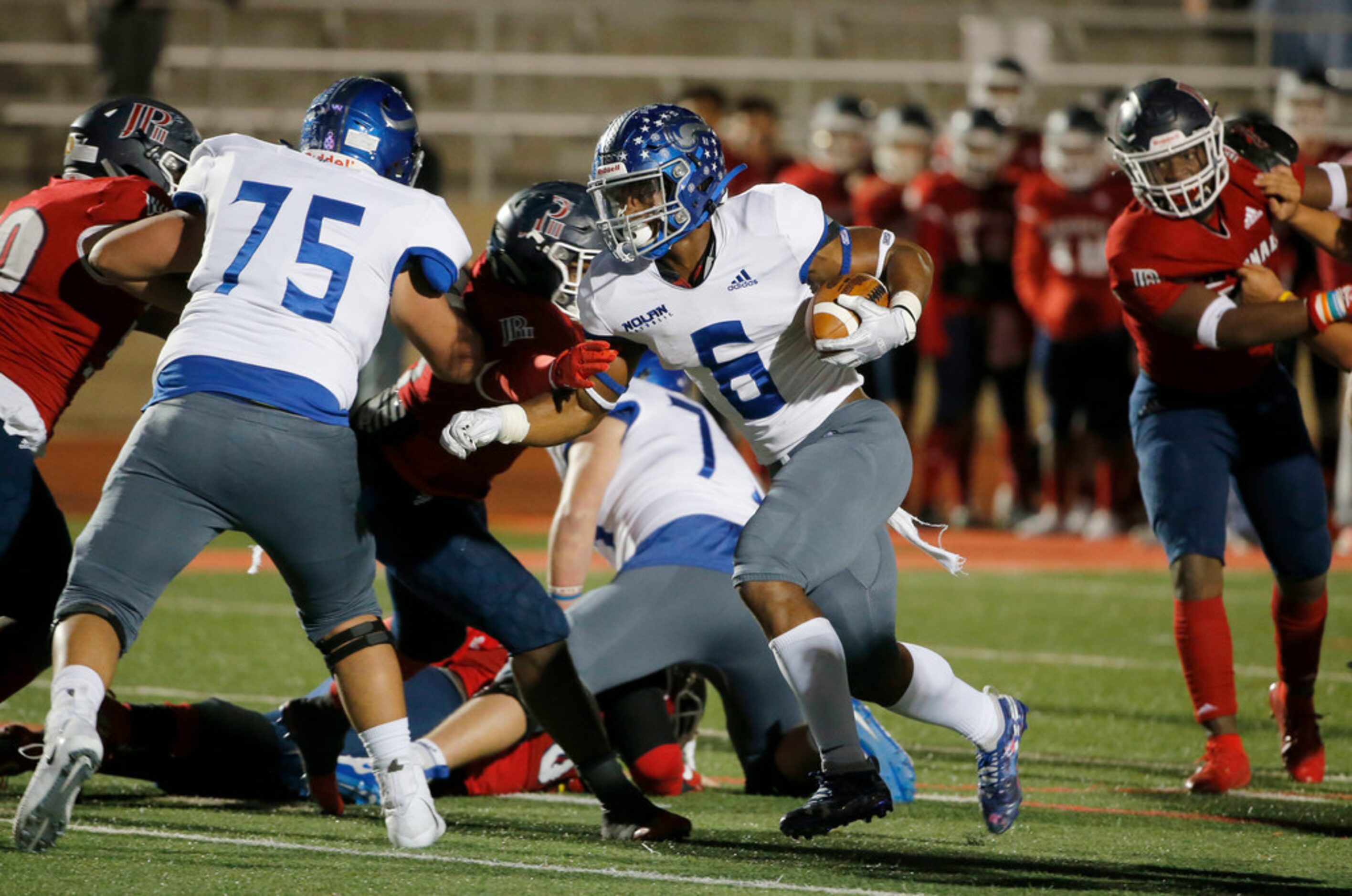 Nolan's Emeka Megwa (6) scores a rushing touchdown agains John Paul II during the first half...