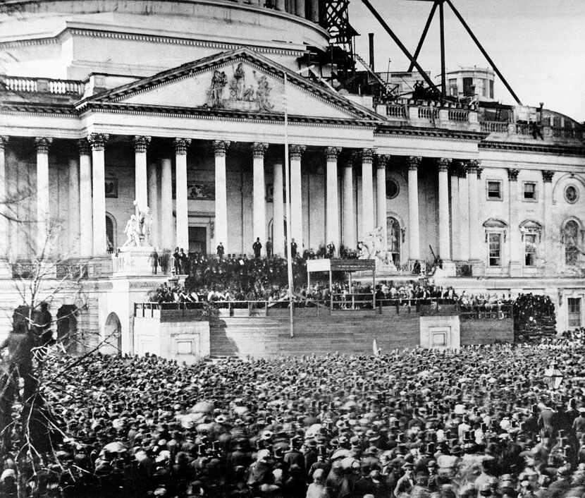 In this March 4, 1861, file photo, U.S. President Abraham Lincoln stands under cover at...