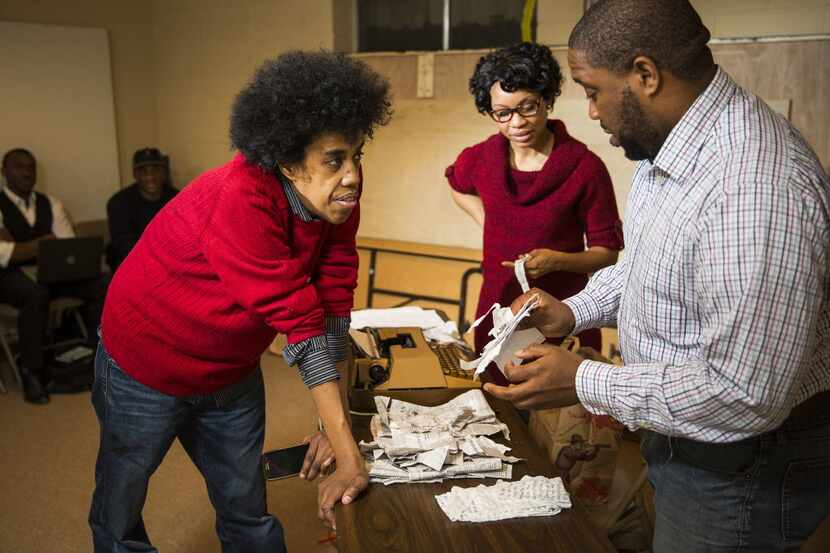Playwright Jonathan Norton (left) and director Derrick Sanders (right) work with Kenneisha...