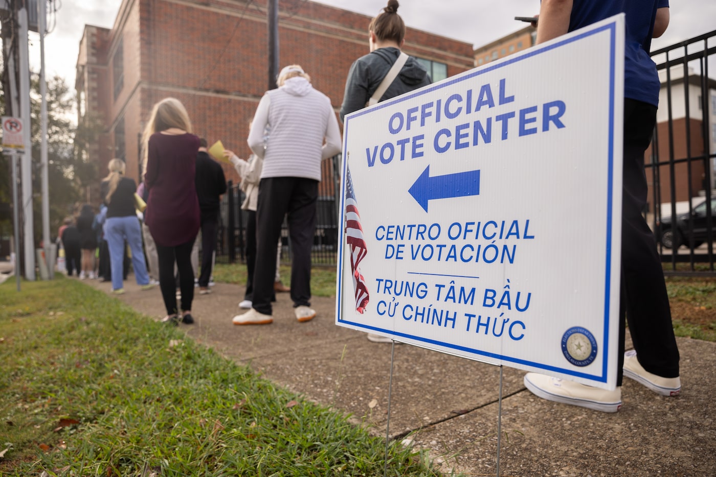 Voters wait in line at the North Dallas High School polling place in Dallas on Election Day...