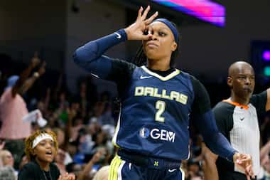 Dallas Wings guard Odyssey Sims (2) celebrates a three-point shot during the second half of...