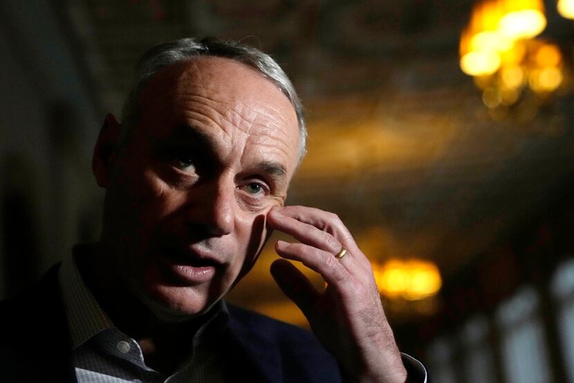 Major League Baseball Commissioner Rob Manfred speaks with the news media after a meeting of...