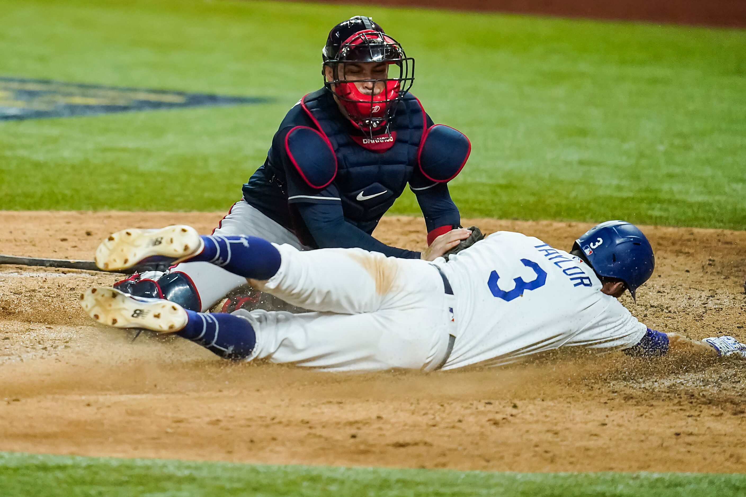 Los Angeles Dodgers second baseman Chris Taylor (3) is out at home as Atlanta Braves catcher...