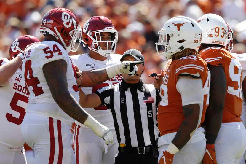 Oklahoma Sooners offensive lineman Marquis Hayes (54) and Texas Longhorns defensive lineman...