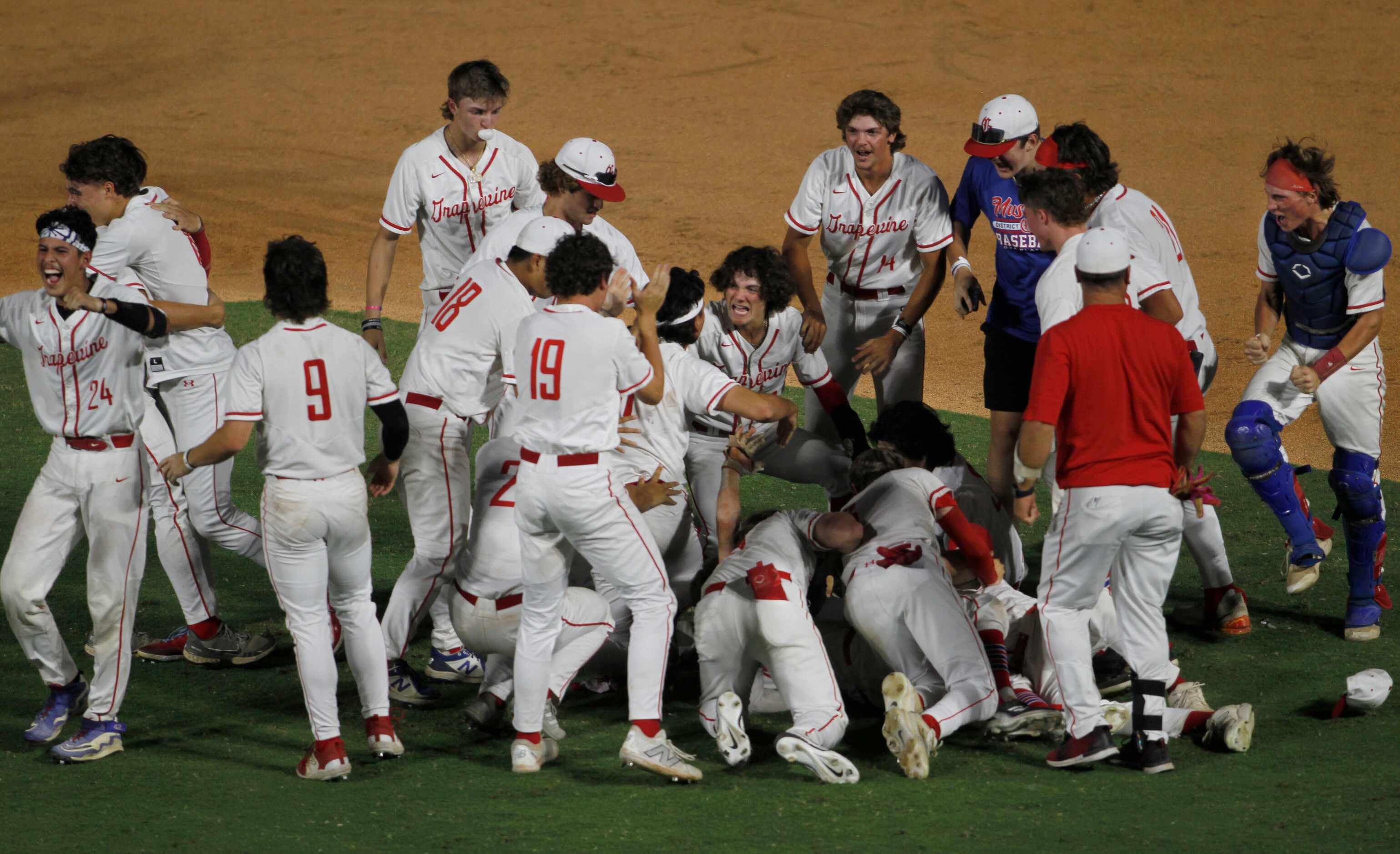 Grapevine players celebrate following their 2-1 come-from-behind victory over Leander Rouse...