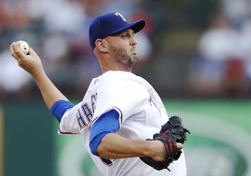 Texas Rangers starting pitcher Matt Harrison (54) pitches during the first inning in a game...