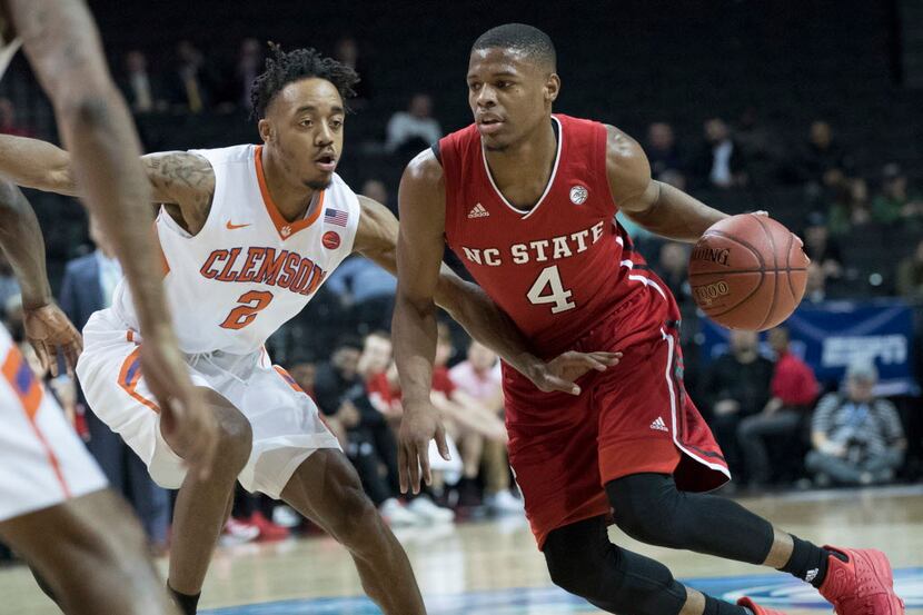 North Carolina State guard Dennis Smith Jr. (4) drives to the basket against Clemson guard...