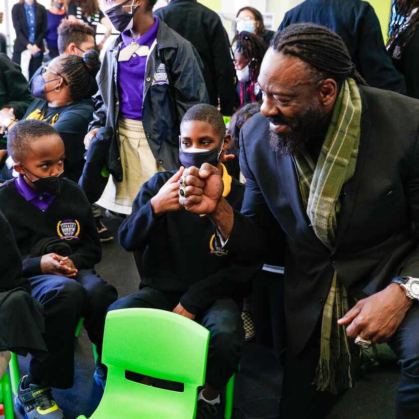 WWE Hall of Famer Booker T visits with students at For Oak Cliff community center for a...
