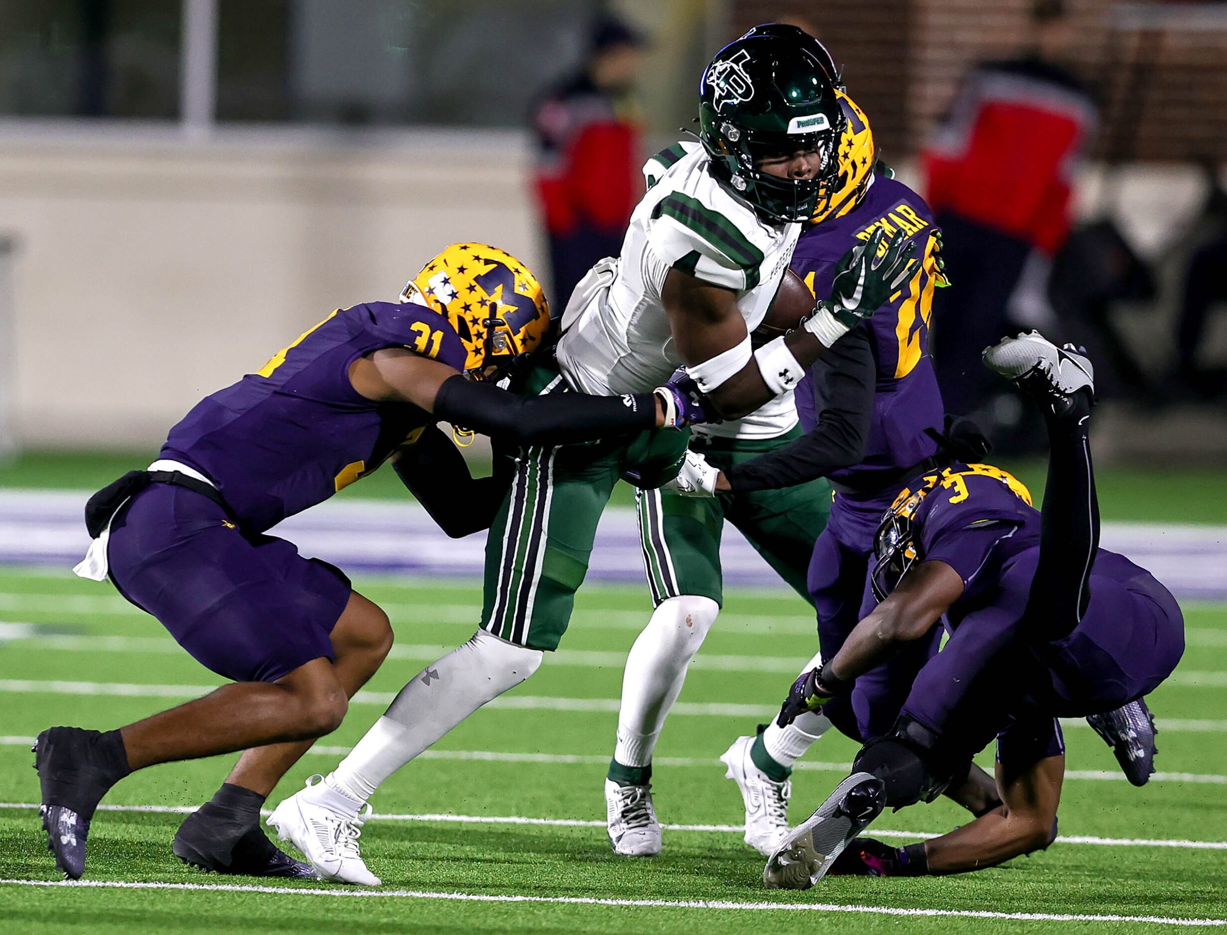 Prosper wide receiver Javan Henry (4) comes up with a reception against McKinney linebacker...