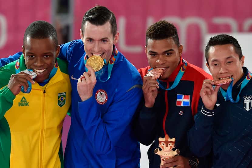 (L to R) Brazil's Verissimo Hernani (silver medal), US Thomas Scott (gold medal), Dominican...