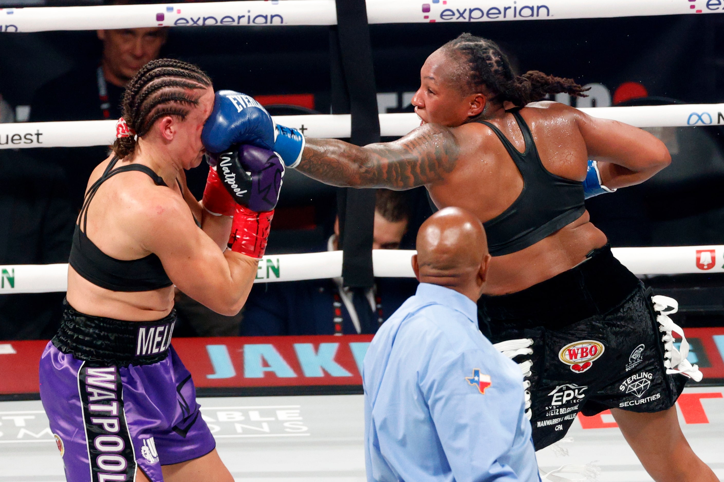 Shadasia Green (left) hits Melinda Watpool with a punch in the face during a super...