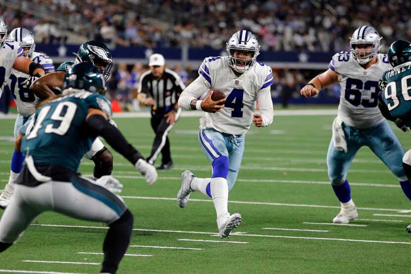 Dallas Cowboys quarterback Dak Prescott (4) scrambles to the two-yard-line during the second...
