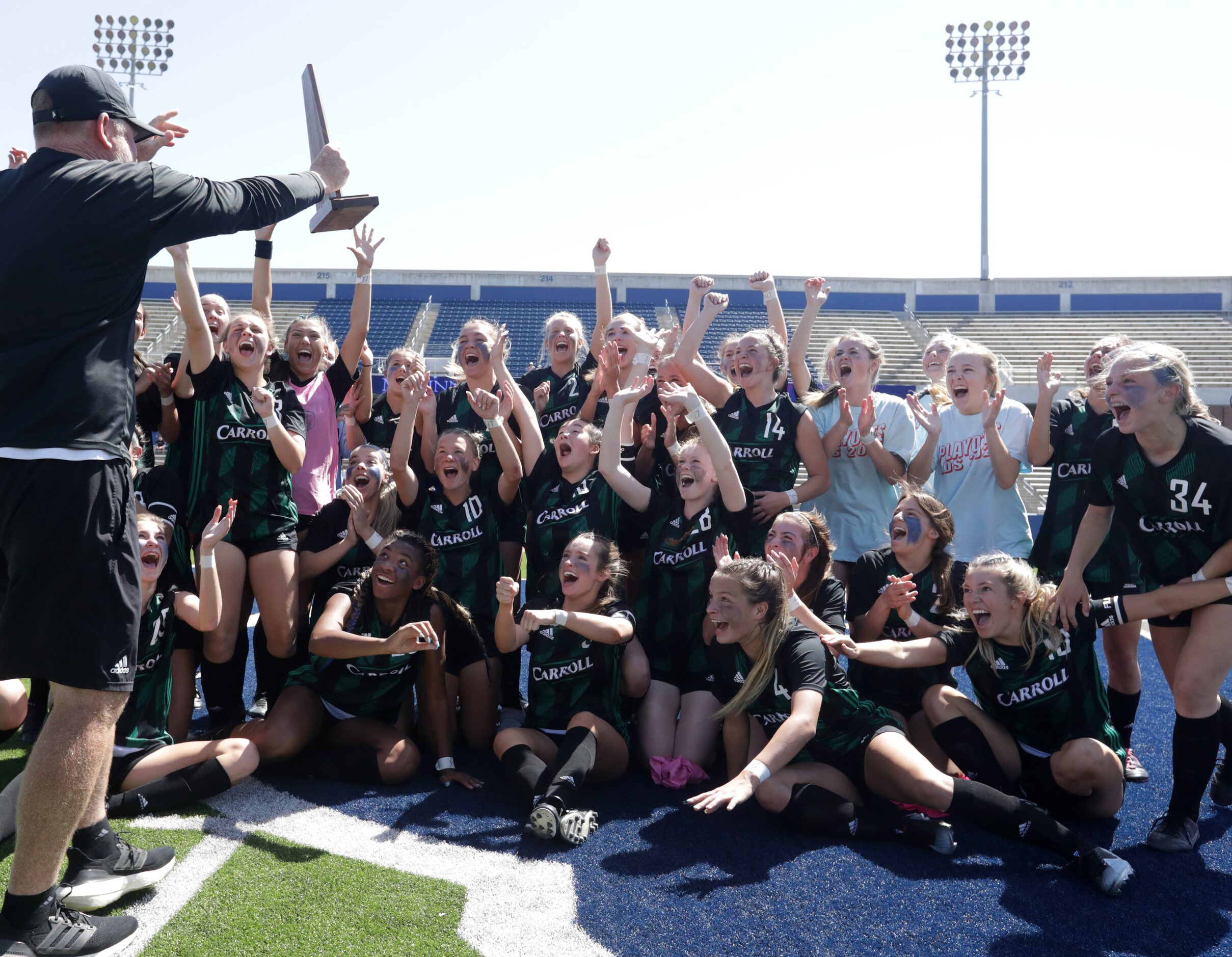 Southlake Carroll players celebrate after winning during a Class 6A Region I championship...