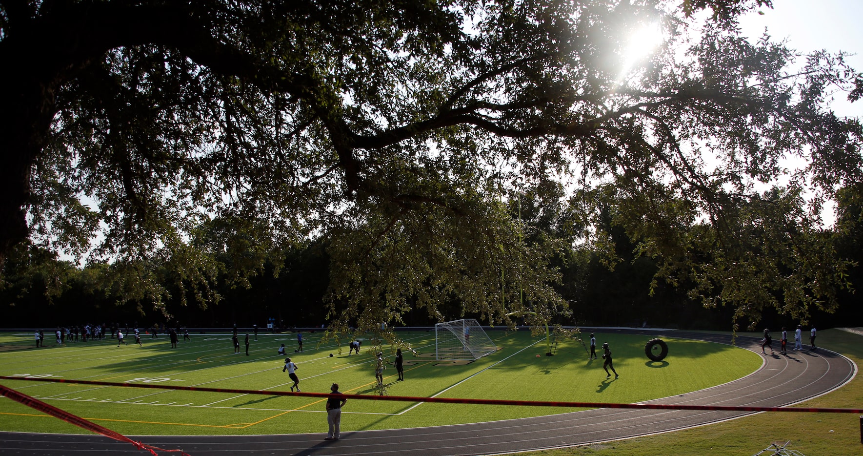 Members of the South Oak Cliff football team start their first practice session of the...