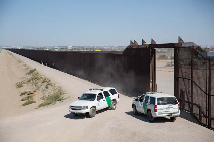 Border Patrol agents along the wall between El Paso, Texas, and Ciudad Juarez, Mexico, on...