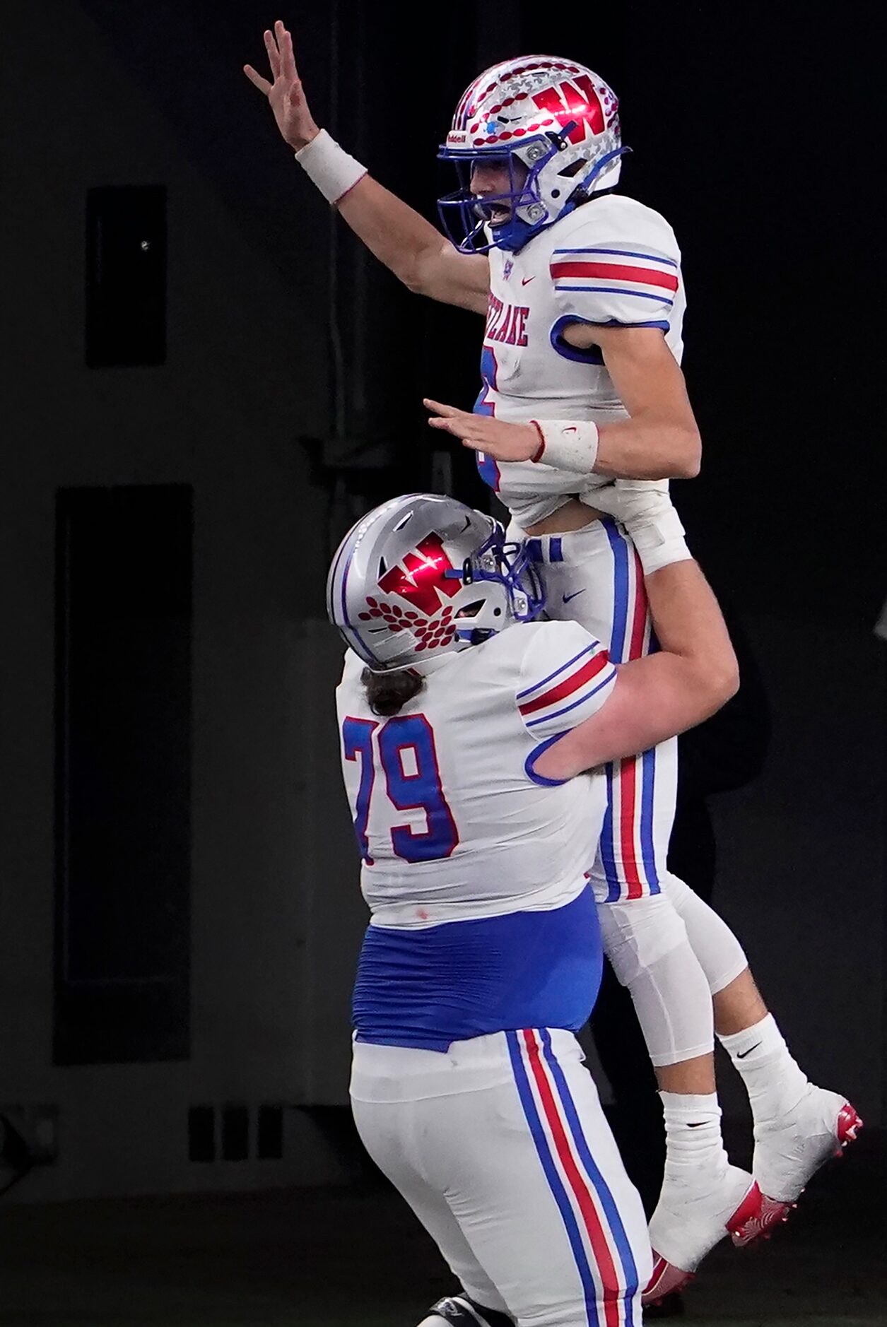 Austin Westlake quarterback Cade Klubnik (6) celebrates with offensive lineman Ryan McMillan...