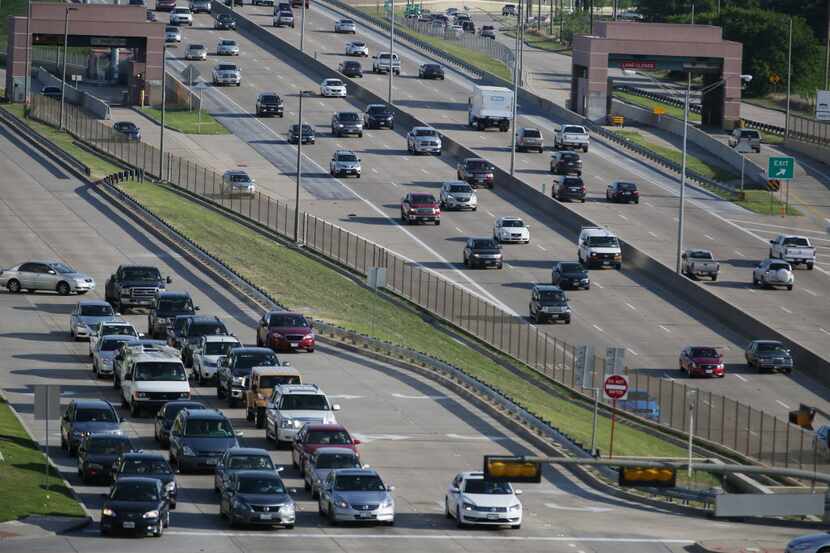  Rush hour traffic exiting at Tennyson Parkway in Plano, Texas, along the Dallas North...