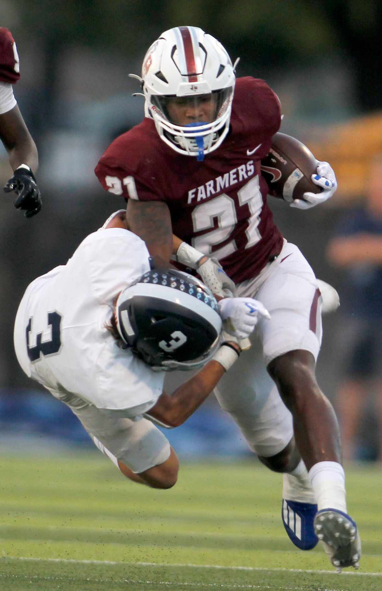Lewisville running back Viron Ellison (21) rambles for a rushing first down as Flower Mound...