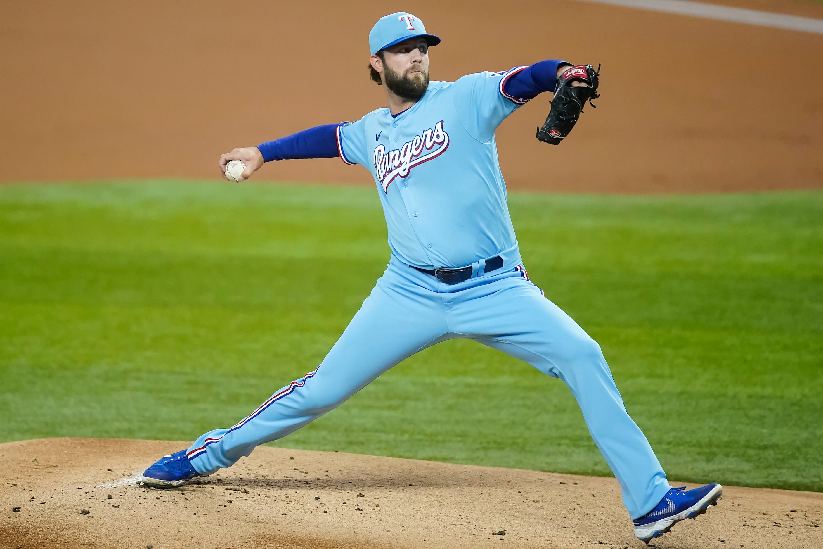 Texas Rangers pitcher Jordan Lyles delivers during the first inning at Globe Life Field on...