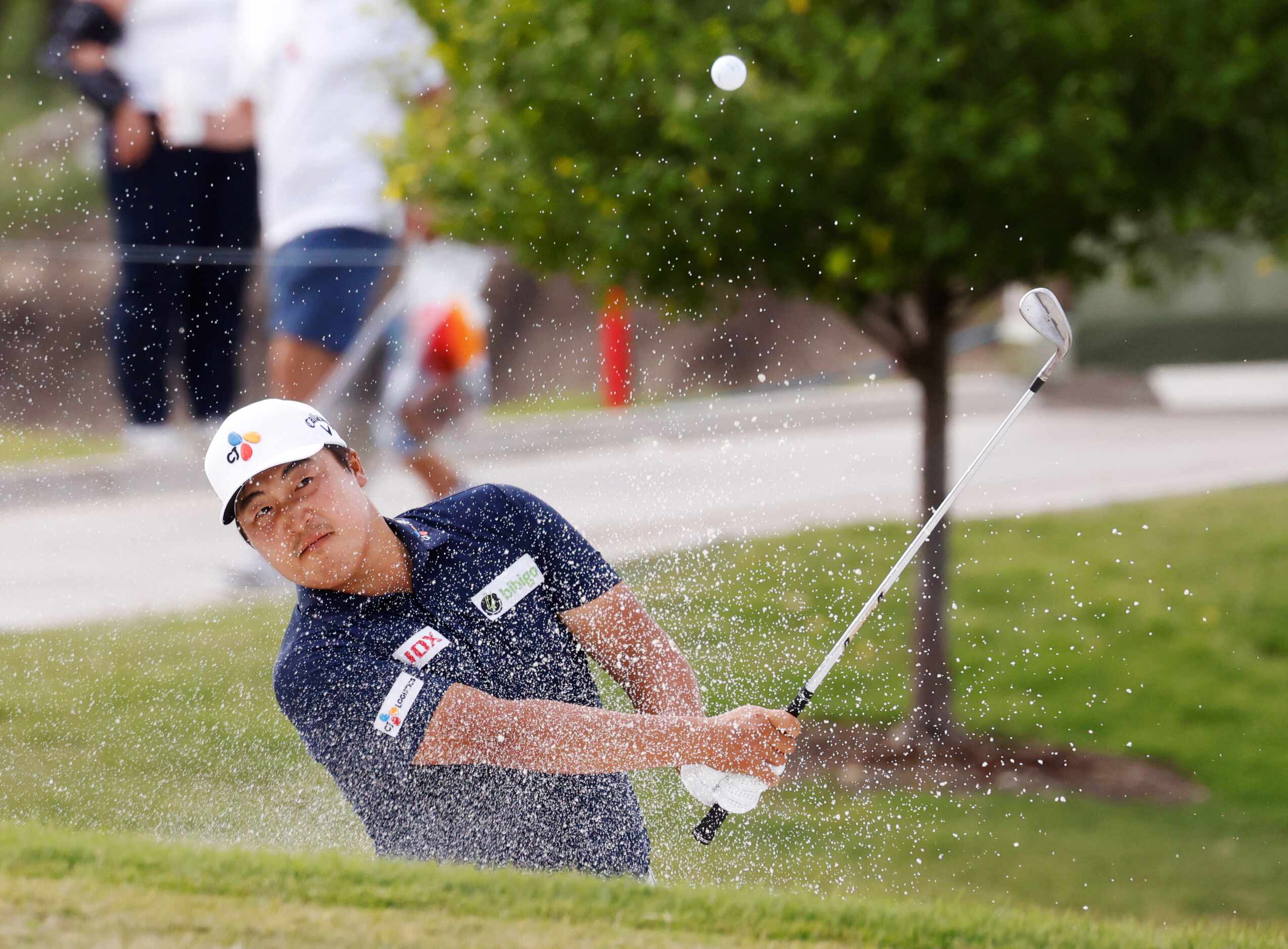 Kyoung-Hoon Lee hits out of a bunker on the 18th hole during round 3 of the AT&T Byron...