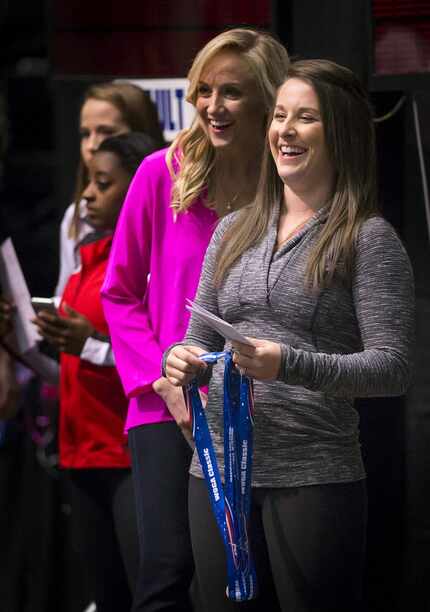 Nastia Liukin laughed with Carly Patterson as they presented medals during the WOGA classic...