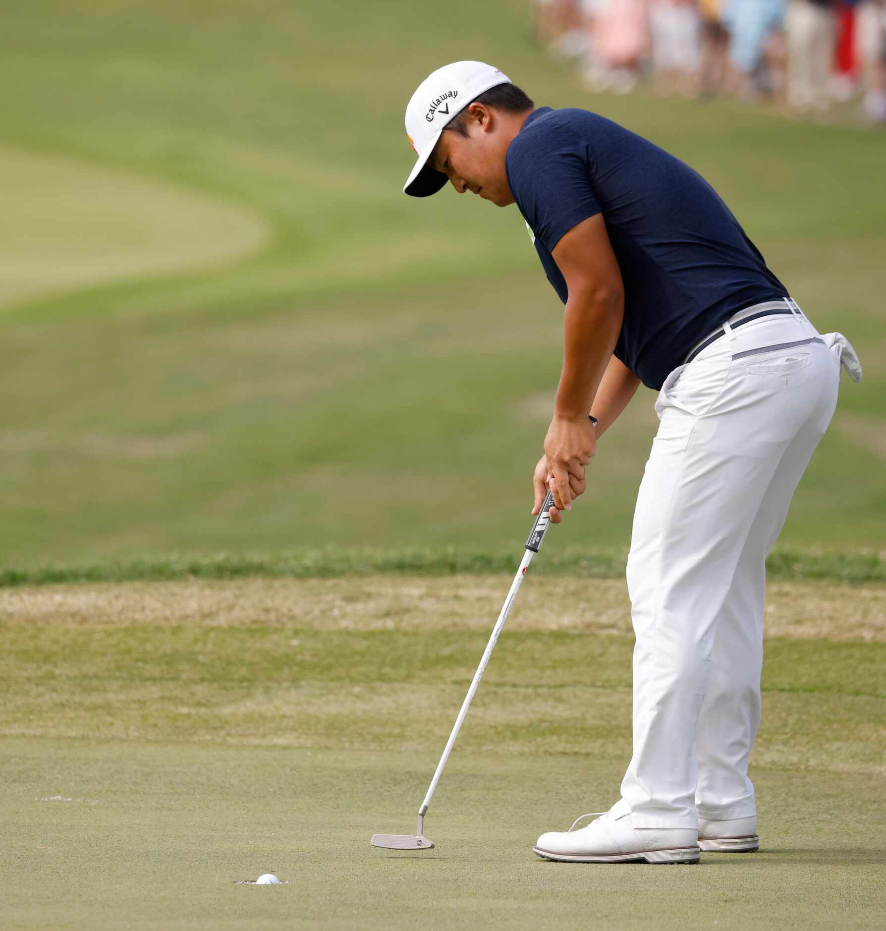 Kyoung-Hoon Lee sinks a birdie on the 18th hole during round 3 of the AT&T Byron Nelson  at...
